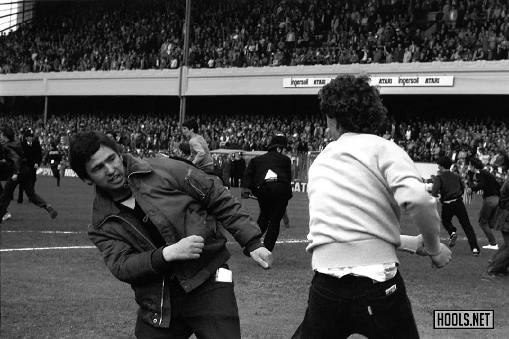 Fans fight on the pitch during a game between Arsenal and Aston Villa at Highbury on 2 May 1981