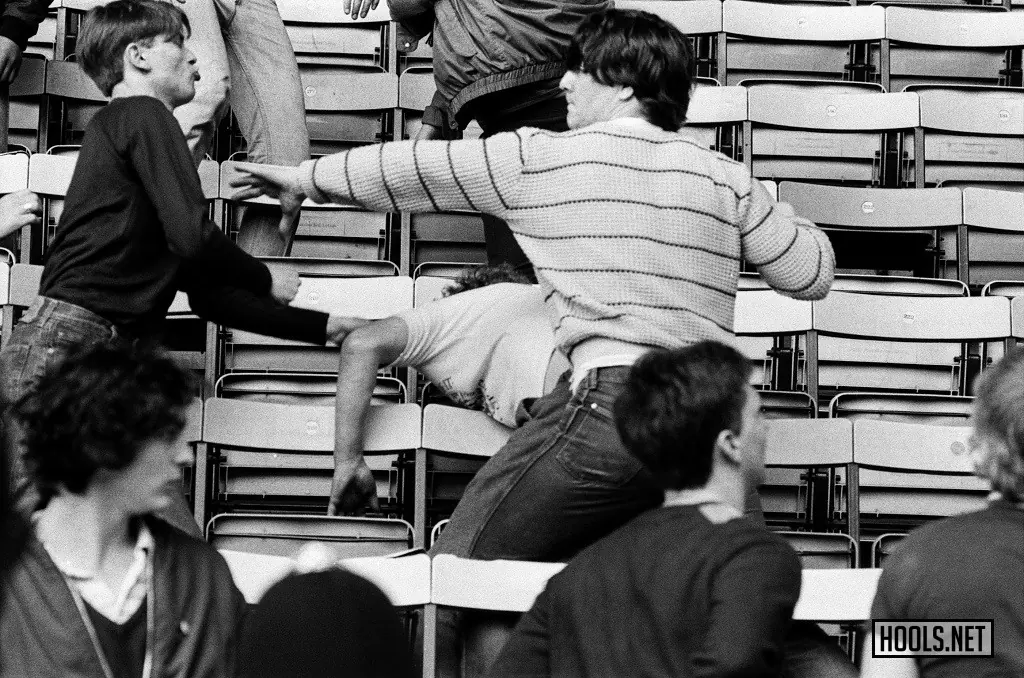 Fans brawl in the stands at a Queens Park Rangers v Wolverhampton Wanderers match on 7 May 1983