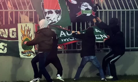 Partizan hools steal Augsburg flags during Europa League match
