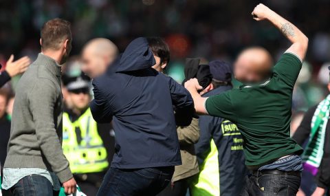 Hibs and Rangers fans fight on pitch after Scottish Cup final