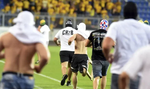 Banik Ostrava fans storm pitch during Opava match