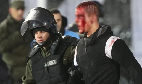 Partizan fans fight each other during Crvena Zvezda game