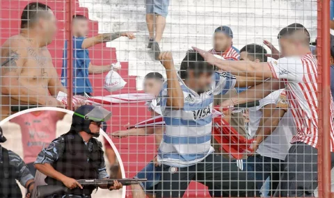 Los Andes fans fight each other during Brown de Adrogue game