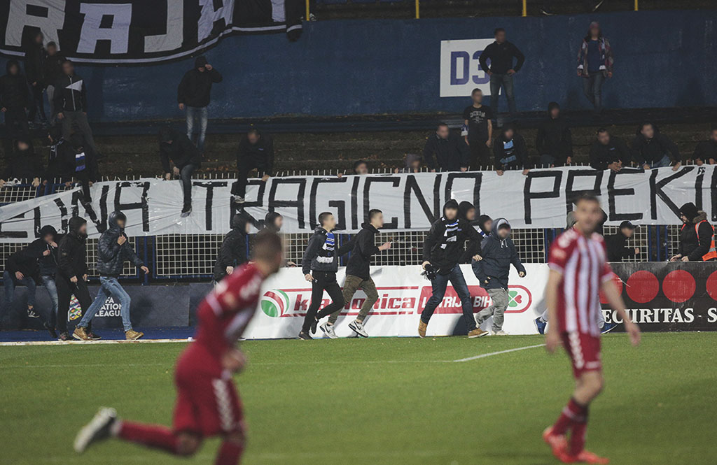 Angry Zeljeznicar fans storm the pitch after their 1-0 home defeat to Zvijezda 09.