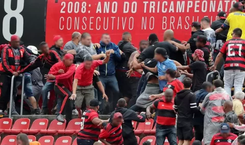 Flamengo fans fight each other at half-time of Sao Paulo match