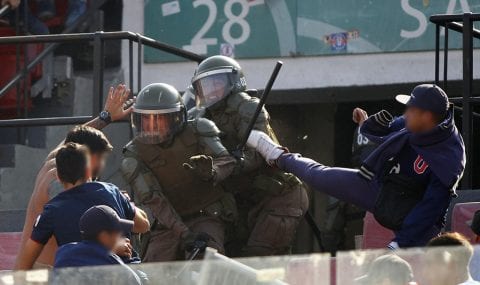 Universidad de Chile fans clash with police in stands prior to kick-off