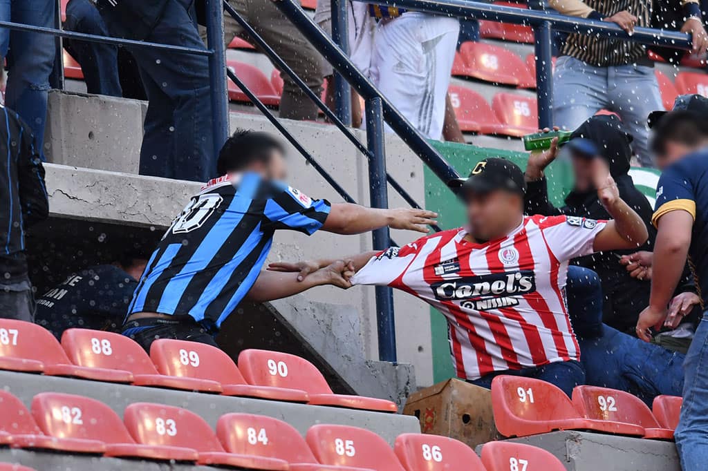 Fans fight in stands during Atletico San Luis v Queretaro match