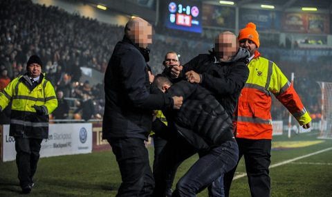 Blackpool fans punch Fleetwood supporter during League One match