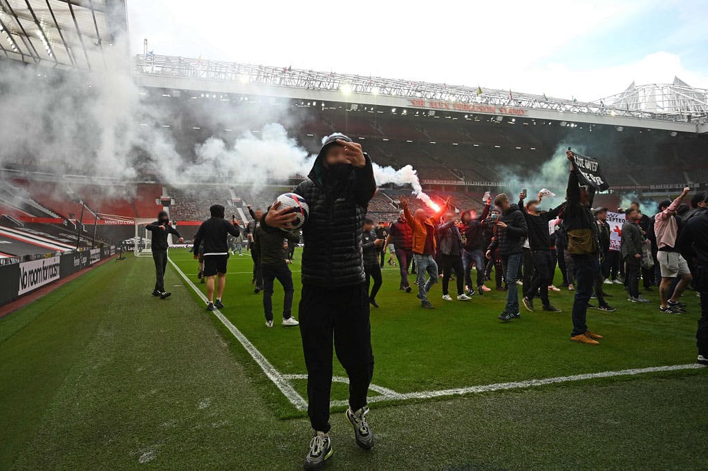 Man Utd fans storm Old Trafford pitch in anti-Glazer protest before