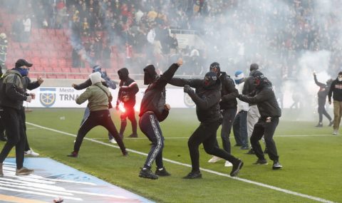 Spartak Trnava and Slovan Bratislava derby falls into chaos as fans clash on pitch