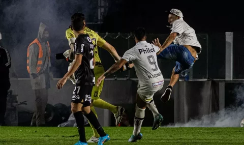 Santos fans invade pitch to confront Corinthians players following cup tie