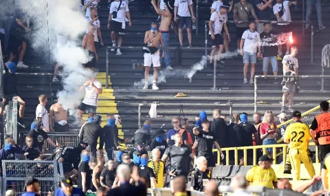 Trouble flares at Dortmund v Copenhagen match as rival fans throw flares at each other