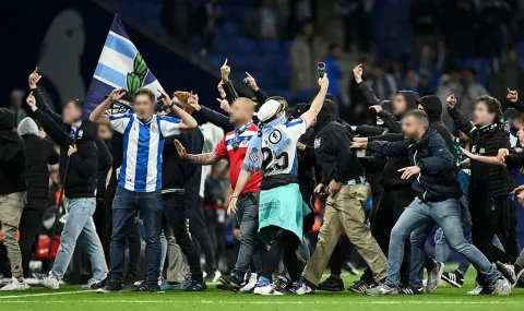 Espanyol fans storm pitch as Barcelona players celebrate La Liga title win