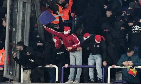 Standard Liege fans throw flares and seats at Anderlecht fans during cup tie
