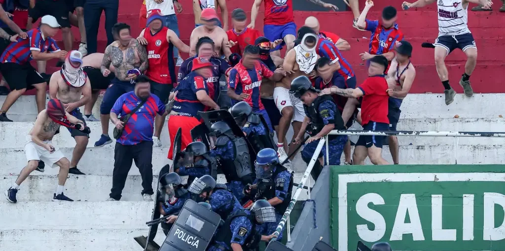 Cerro Porteno fans clash with police during derby against Olimpia
