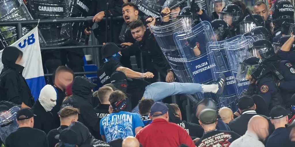Slovan fans clash with police during Champions League match at Roma