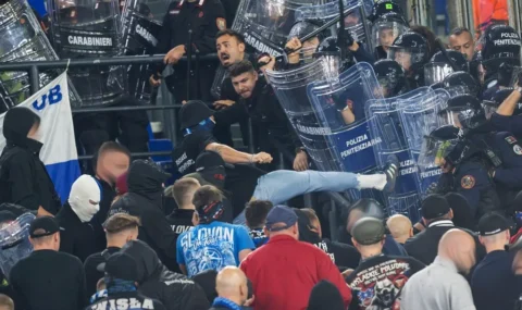 Slovan fans clash with police during Champions League match at Roma